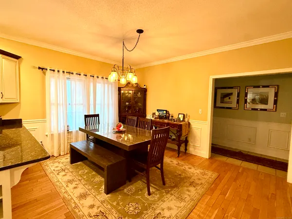 a living room with furniture a window and a flat screen tv