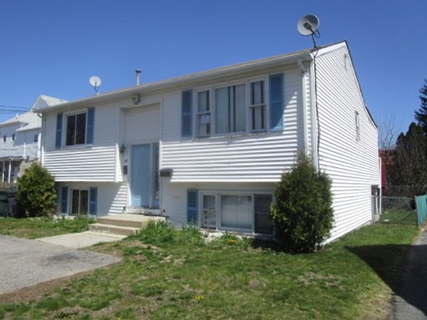 54 Daniel Avenue Providence, RI 02909 - Photo 1 of 2 a front view of a house with a garden