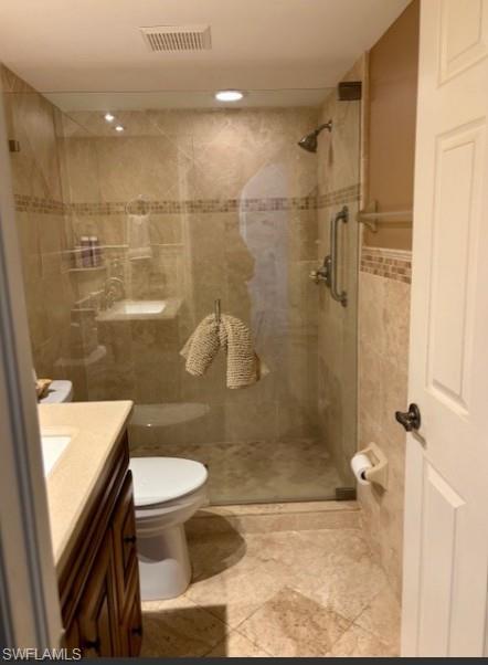 605 Augusta Boulevard, Unit 4 Naples, FL 34113 - Photo 12 of 25 a bathroom with a sink and a shower