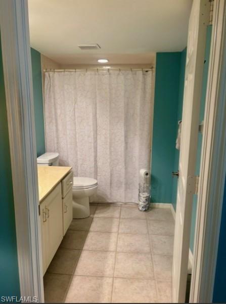 605 Augusta Boulevard, Unit 4 Naples, FL 34113 - Photo 13 of 25 a bathroom with a sink a toilet and shower