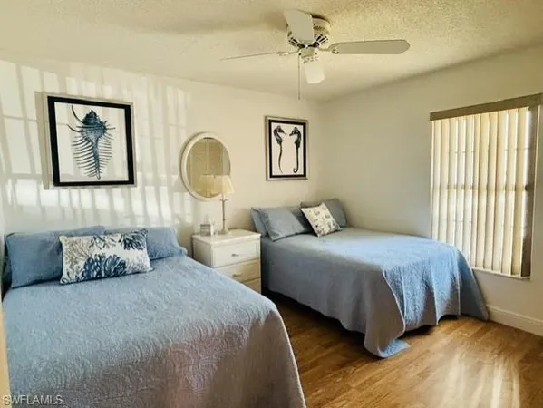 a bedroom with a bed and lamp