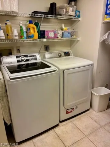 a view of a porch with furniture and a yard