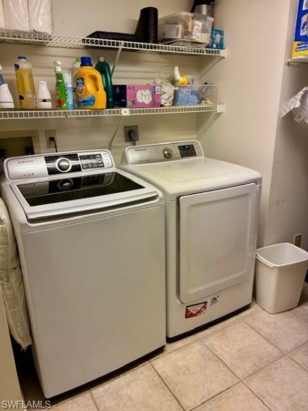 605 Augusta Boulevard, Unit 4 Naples, FL 34113 - Photo 17 of 25 a utility room with dryer and washer