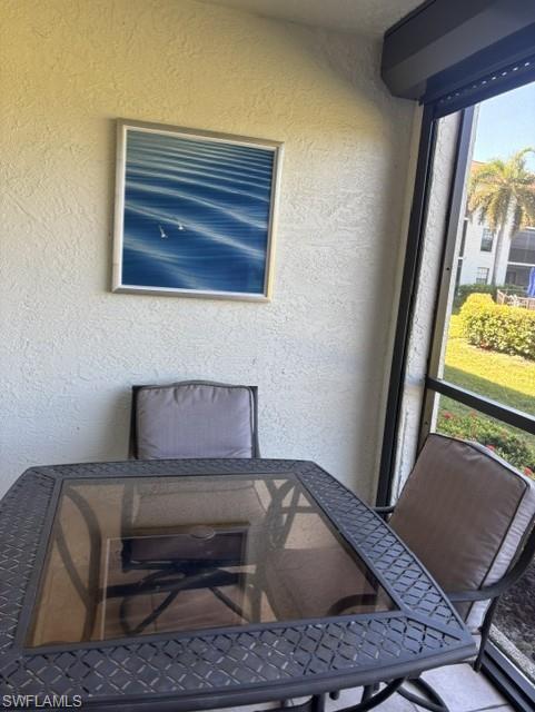 605 Augusta Boulevard, Unit 4 Naples, FL 34113 - Photo 20 of 25 a living room with furniture and a window