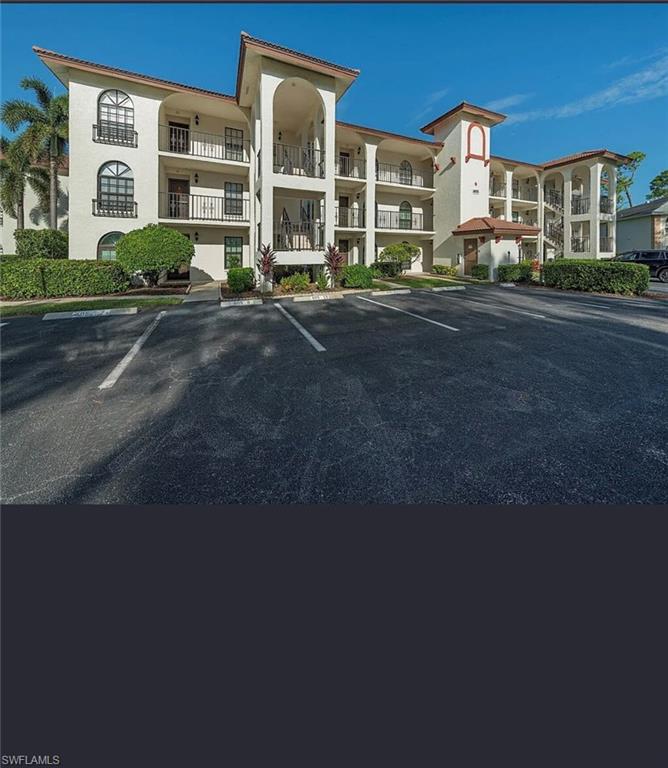 605 Augusta Boulevard, Unit 4 Naples, FL 34113 - Photo 22 of 25 a front view of a building with street view