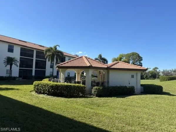 a view of a lake with a big yard