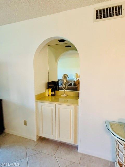 605 Augusta Boulevard, Unit 4 Naples, FL 34113 - Photo 7 of 25 a bathroom with a sink and mirror