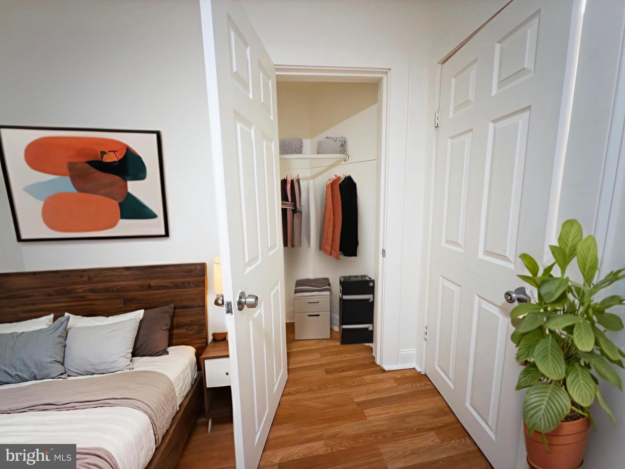 3316 West Belvedere Avenue Baltimore, MD 21215 - Photo 11 of 19 a bedroom with furniture and a potted plant