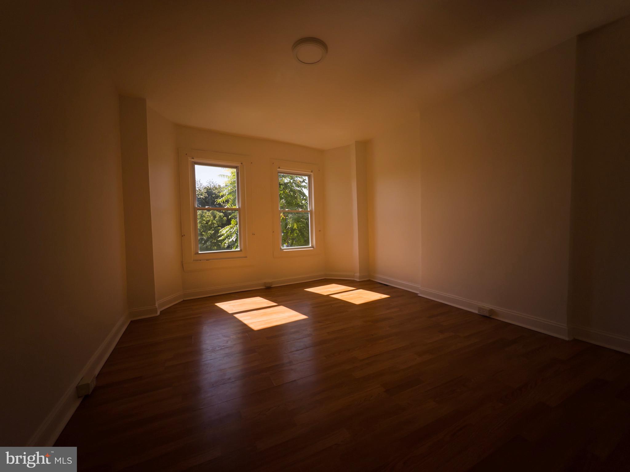 3316 West Belvedere Avenue Baltimore, MD 21215 - Photo 9 of 19 an empty room with a window