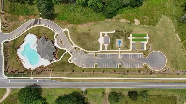 a view of a swimming pool with a yard