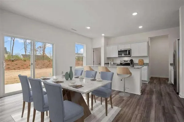 a living room with furniture and a table