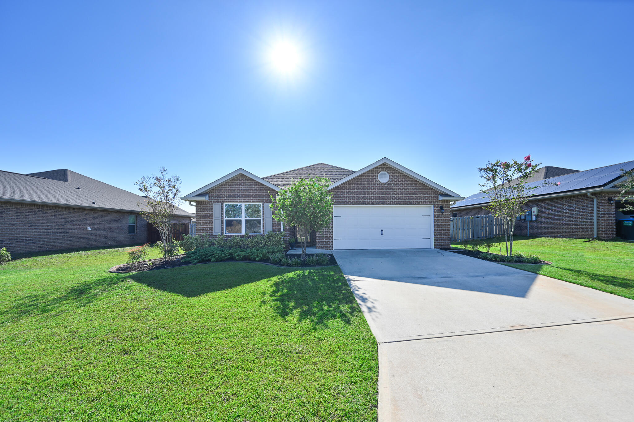 351 Merlin Court Crestview, FL 32539 - Photo 1 of 63 a front view of a house with garden