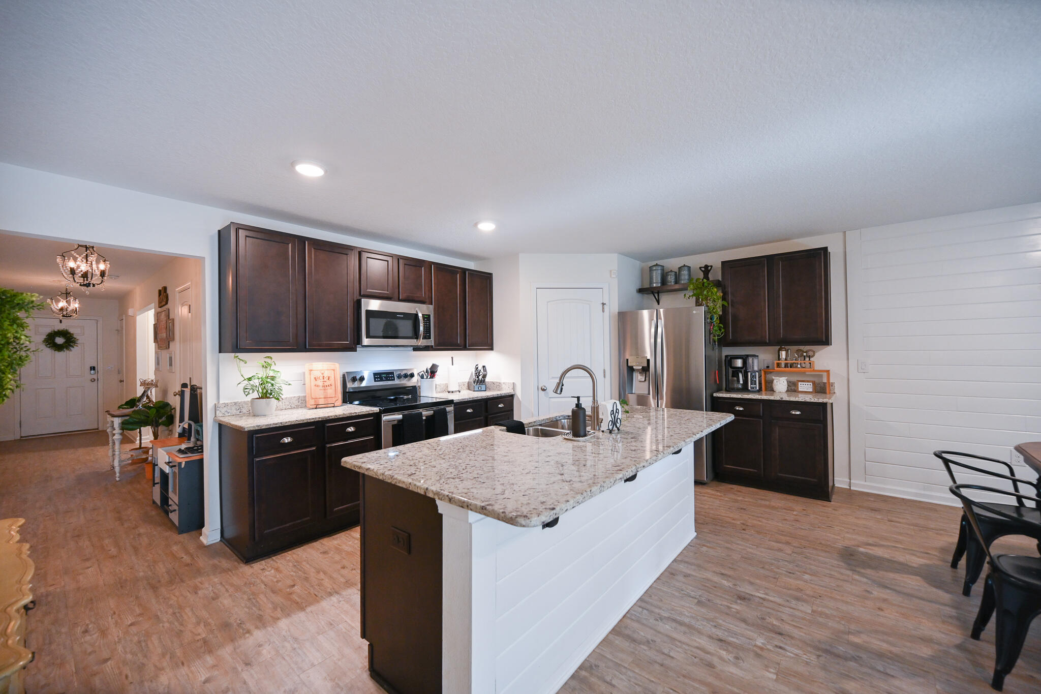 351 Merlin Court Crestview, FL 32539 - Photo 11 of 63 a large kitchen with kitchen island a sink stove and refrigerator