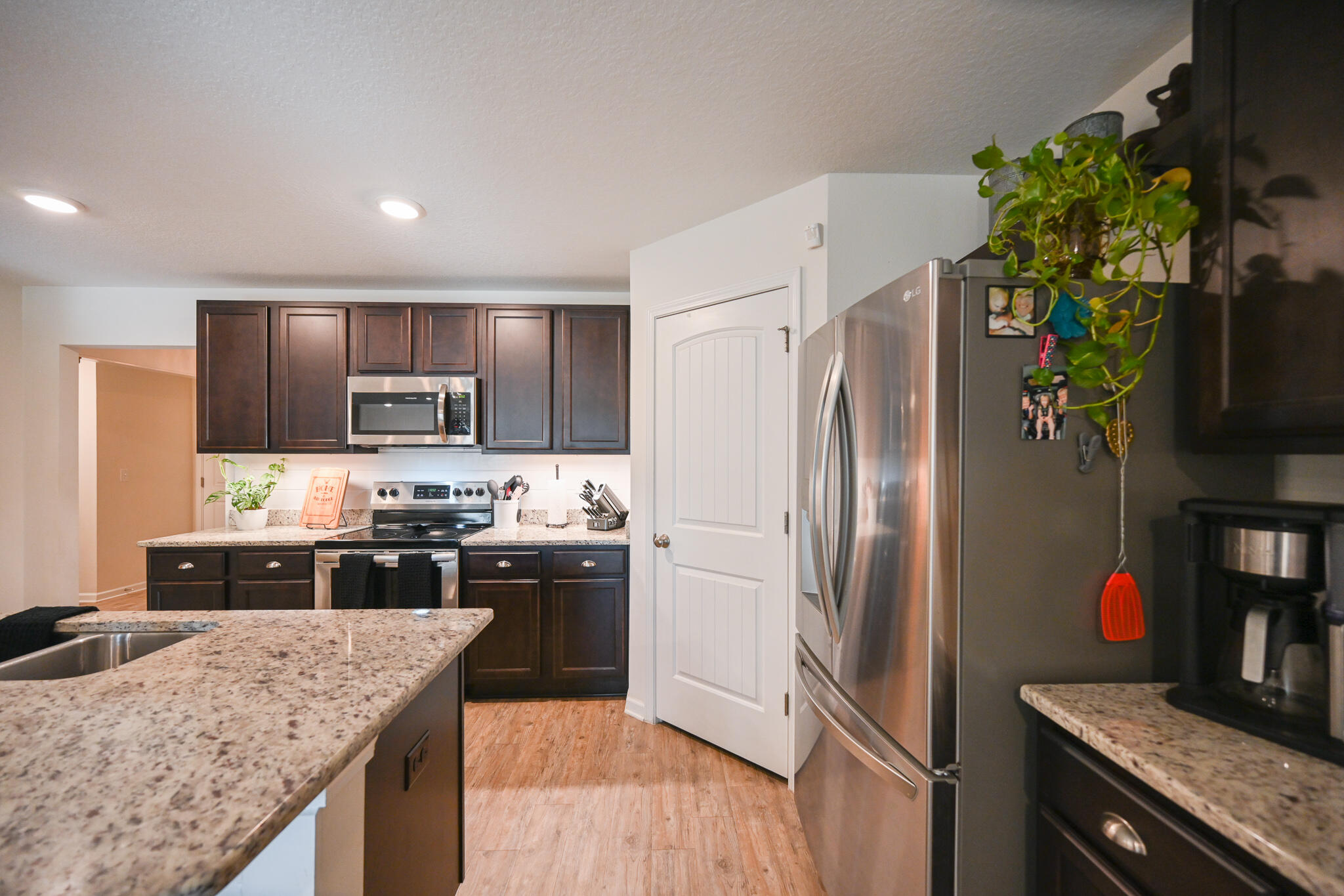 351 Merlin Court Crestview, FL 32539 - Photo 16 of 63 a kitchen with stainless steel appliances granite countertop a refrigerator a stove top oven a sink and dishwasher