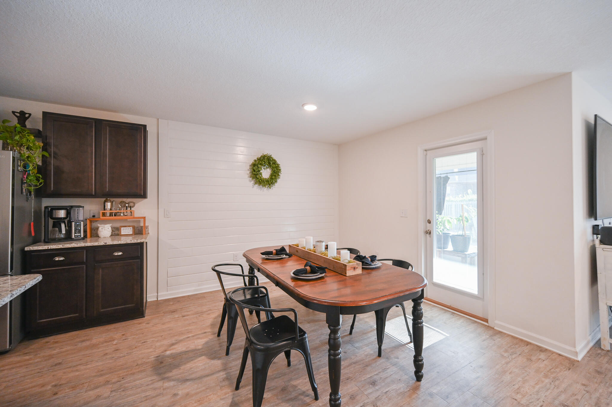 351 Merlin Court Crestview, FL 32539 - Photo 19 of 63 a view of a dining room with furniture and wooden floor