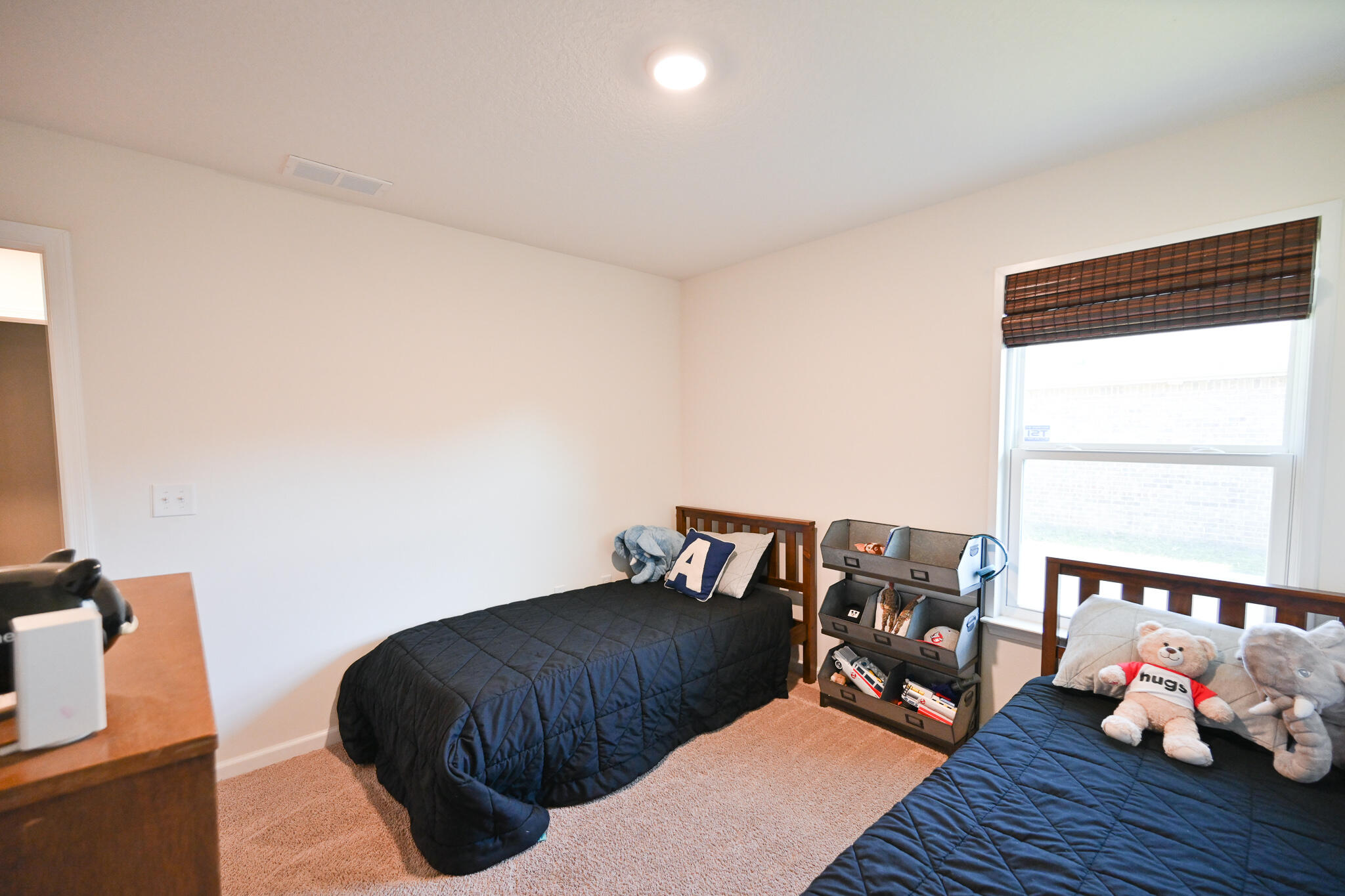 351 Merlin Court Crestview, FL 32539 - Photo 27 of 63 a bedroom with a bed and wooden floor