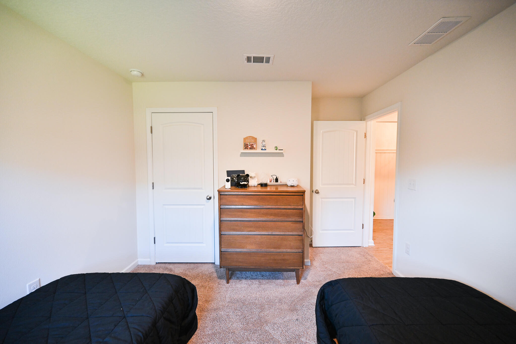 351 Merlin Court Crestview, FL 32539 - Photo 28 of 63 a room with a bed and a dresser