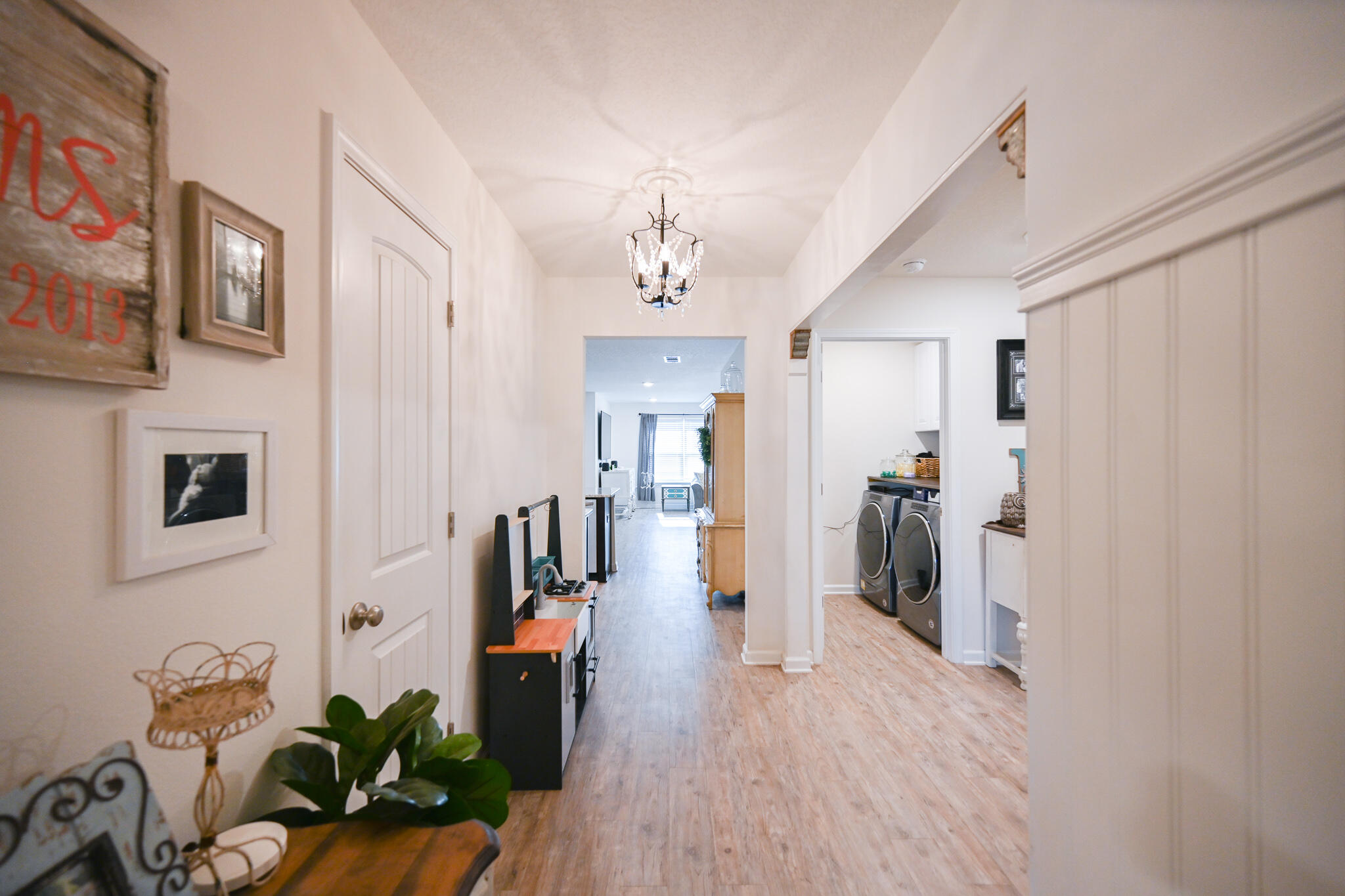 351 Merlin Court Crestview, FL 32539 - Photo 29 of 63 a living room with furniture and a chandelier
