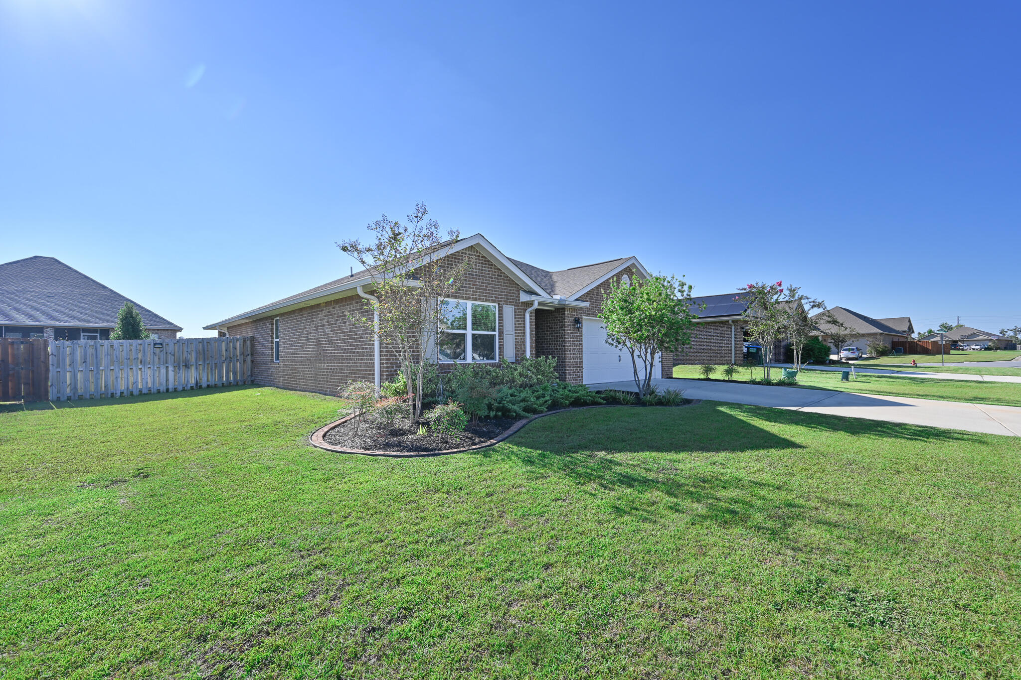 351 Merlin Court Crestview, FL 32539 - Photo 3 of 63 a front view of a house with a yard and garage