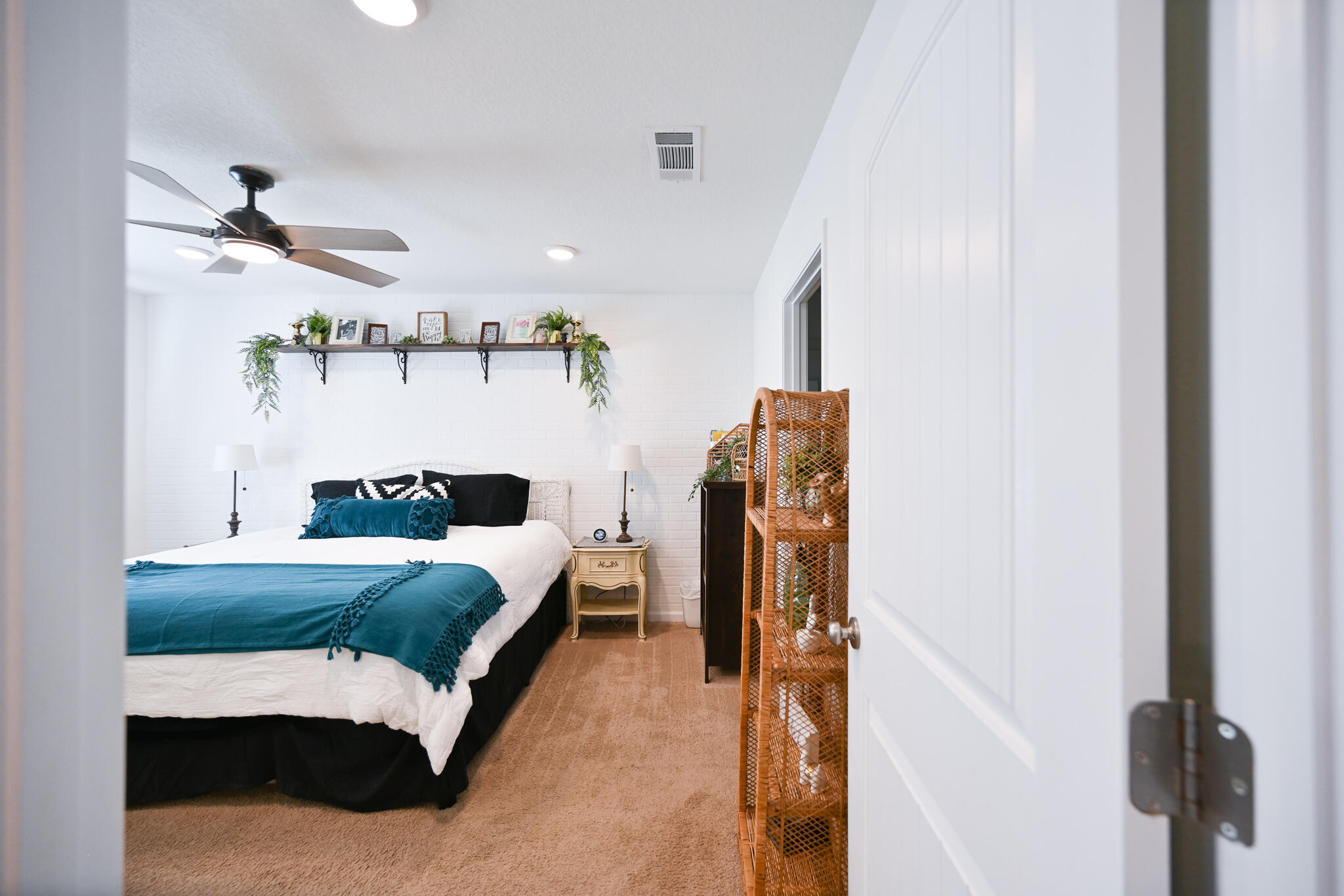 351 Merlin Court Crestview, FL 32539 - Photo 38 of 63 a spacious bedroom with a bed and a chandelier