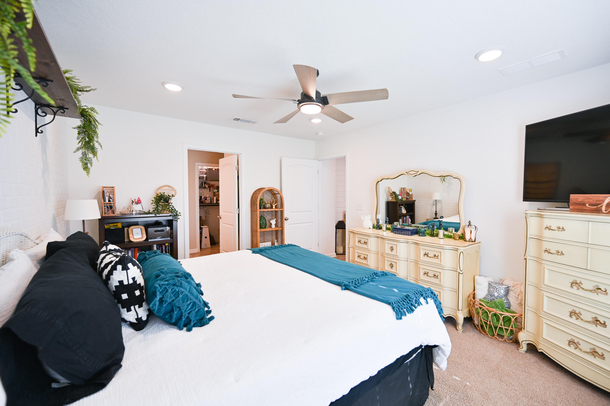 351 Merlin Court Crestview, FL 32539 - Photo 40 of 63 a bedroom with a bed and a flat tv screen on dresser
