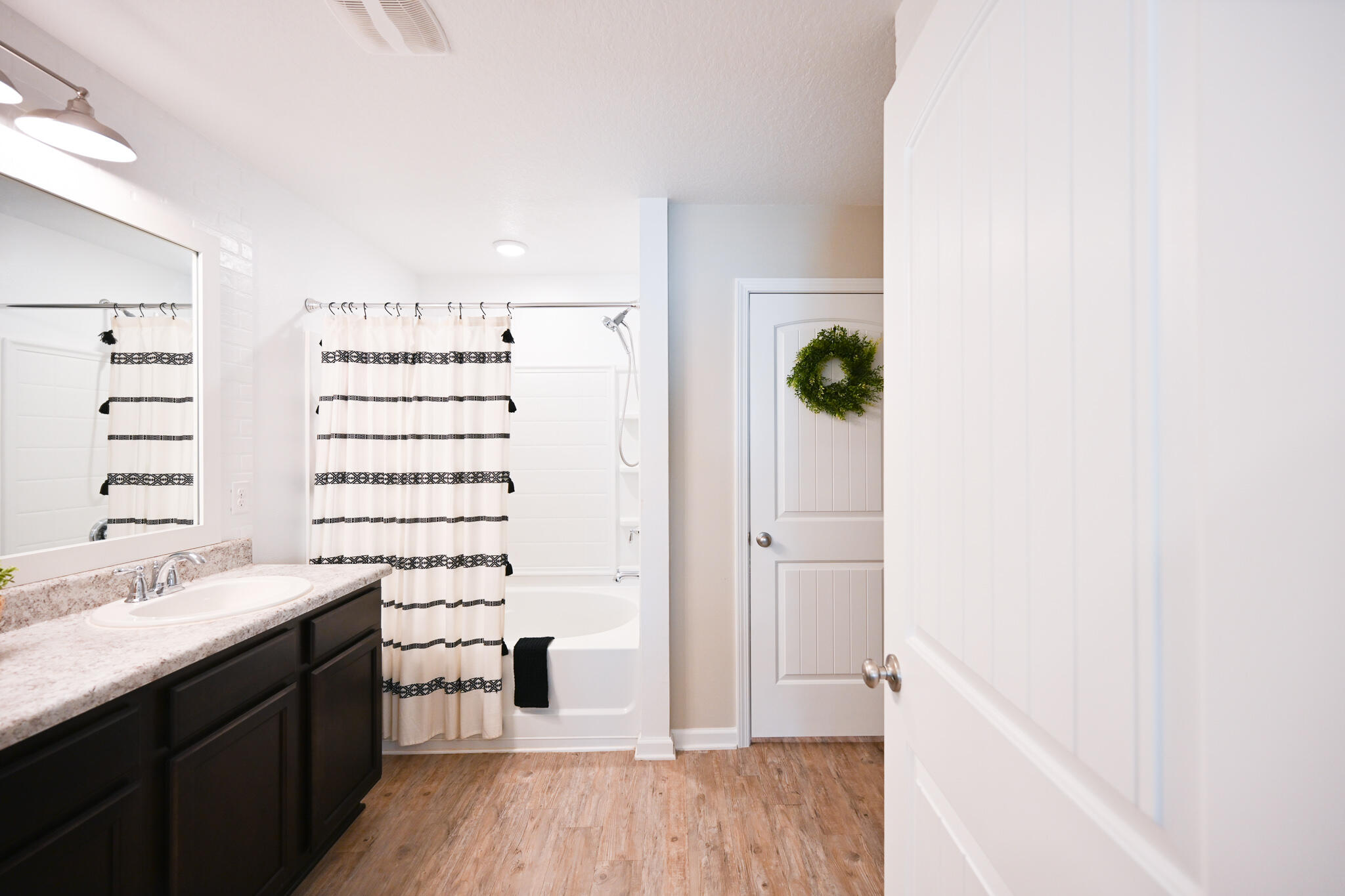 351 Merlin Court Crestview, FL 32539 - Photo 42 of 63 a bathroom with a double vanity sink toilet and shower