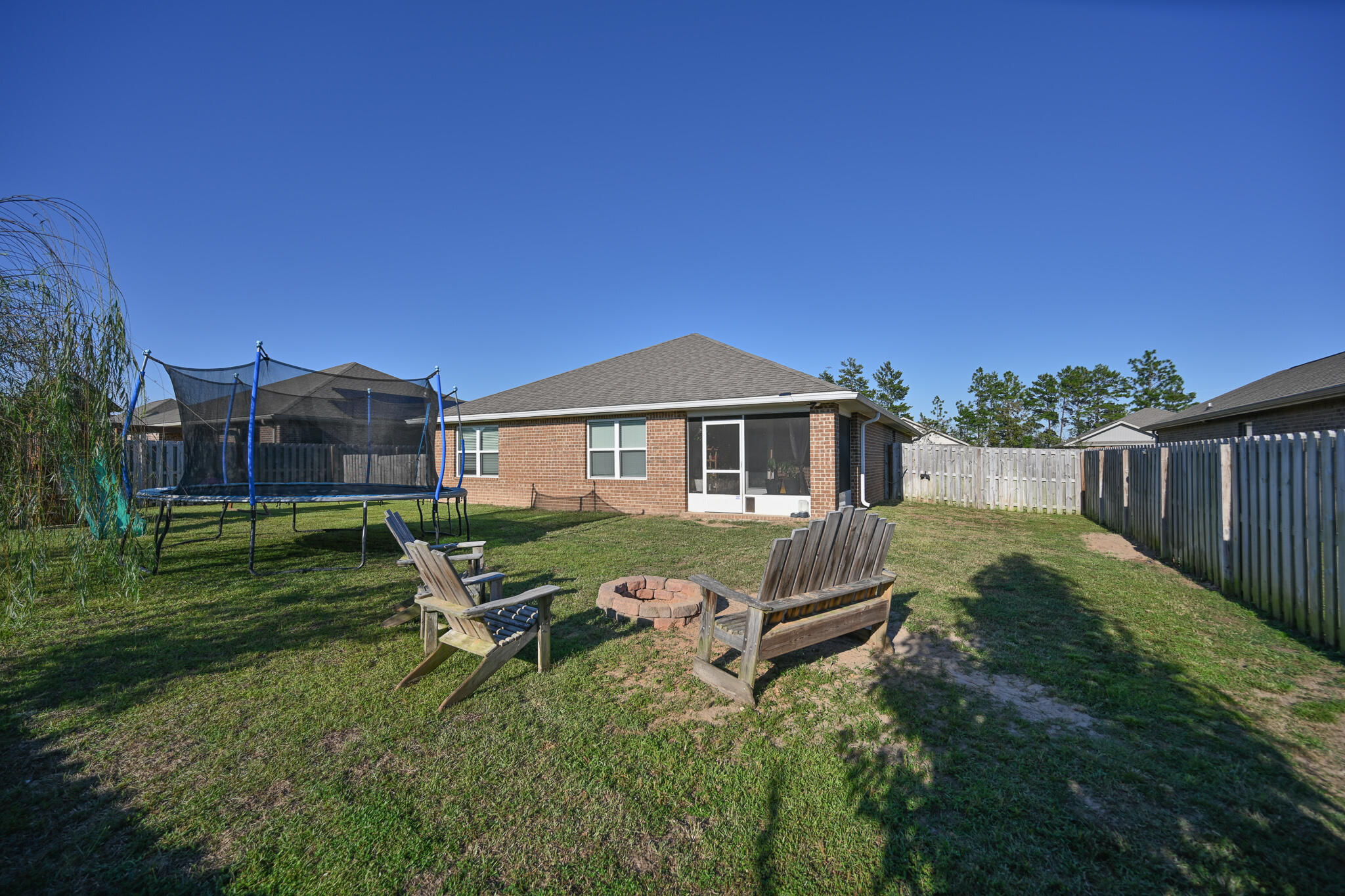 351 Merlin Court Crestview, FL 32539 - Photo 57 of 63 a aerial view of a house with a yard table and chairs