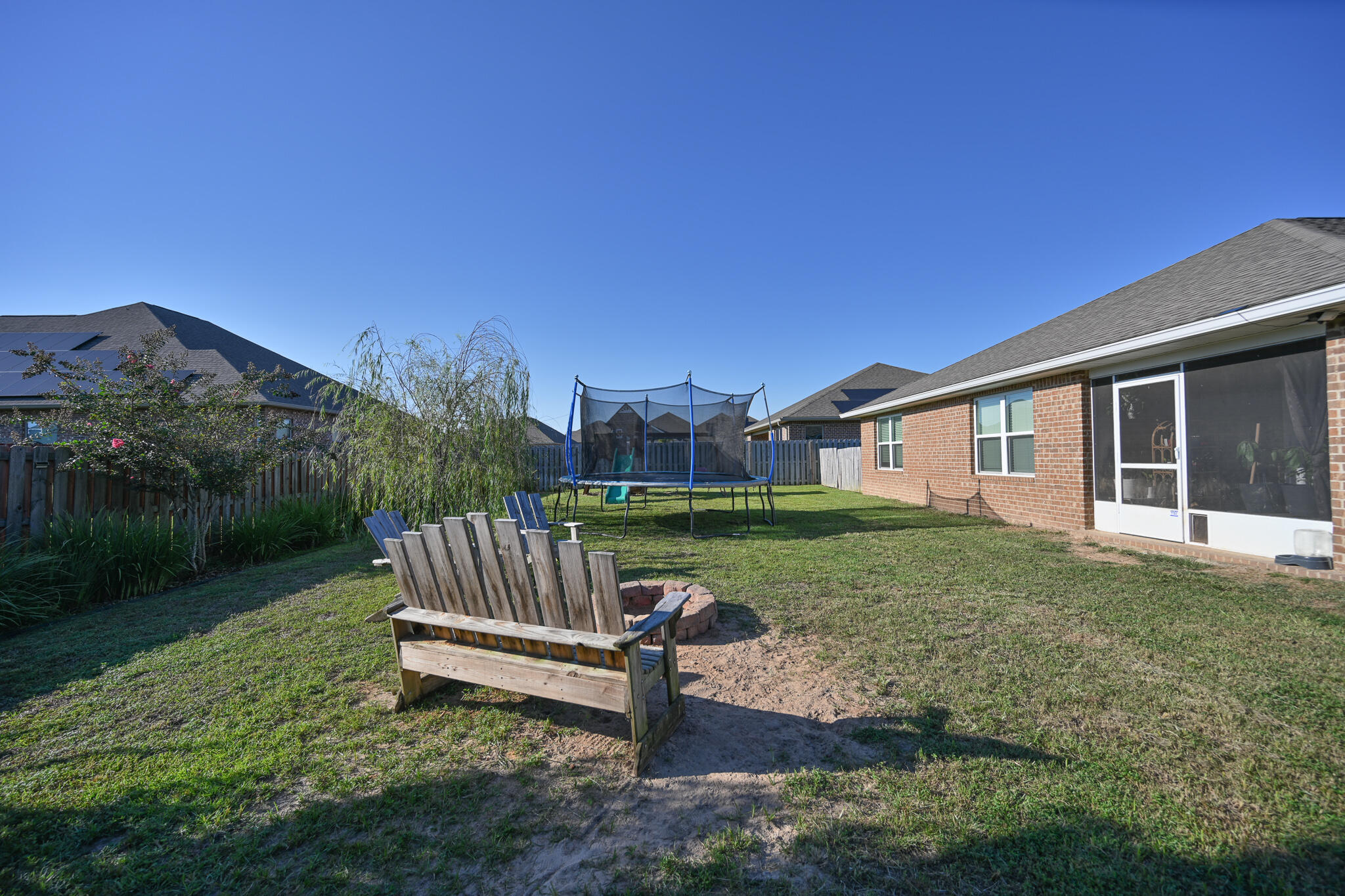 351 Merlin Court Crestview, FL 32539 - Photo 58 of 63 a view of a house with a yard and sitting area