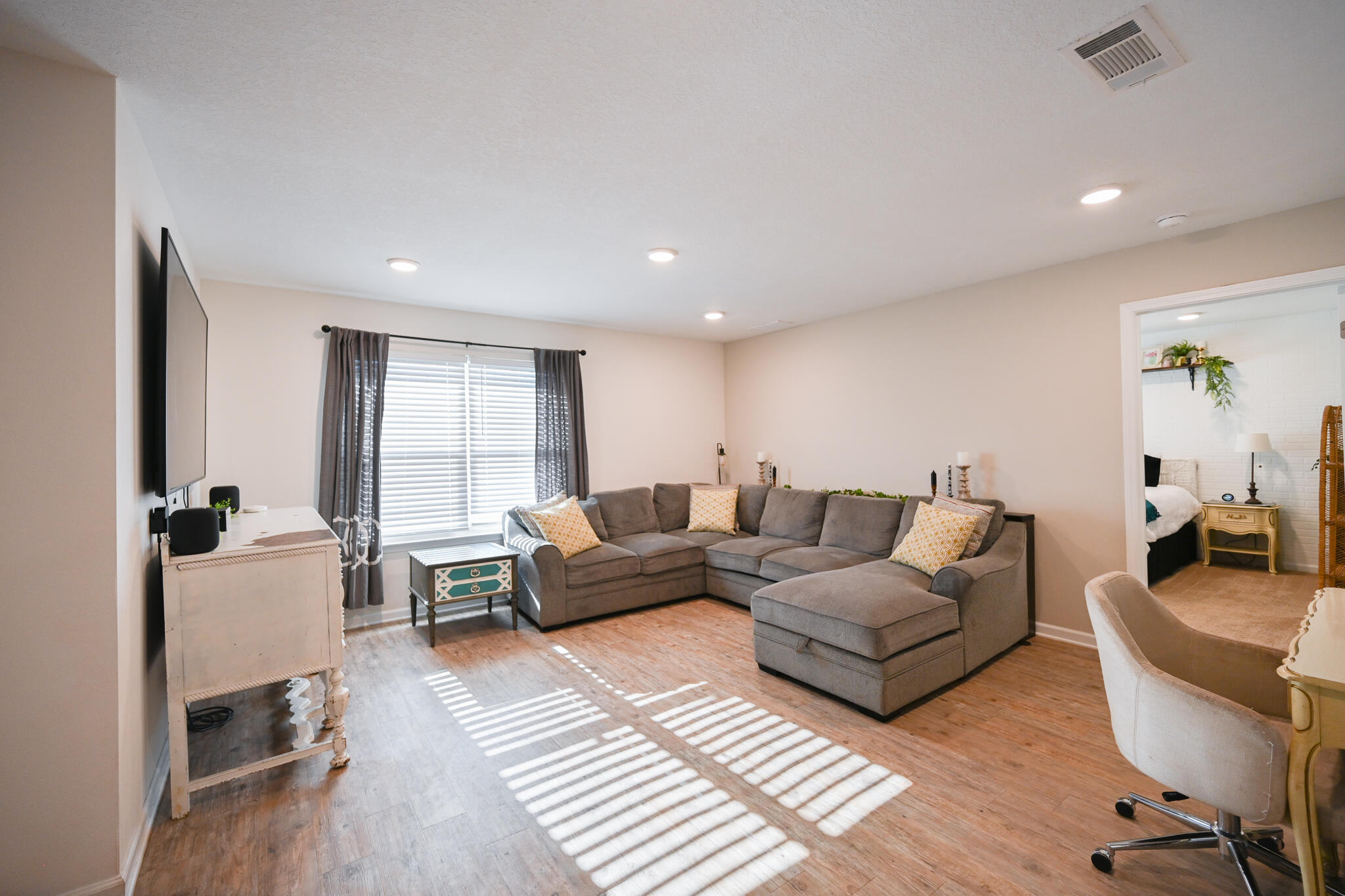 351 Merlin Court Crestview, FL 32539 - Photo 8 of 63 a living room with furniture and a wooden floor