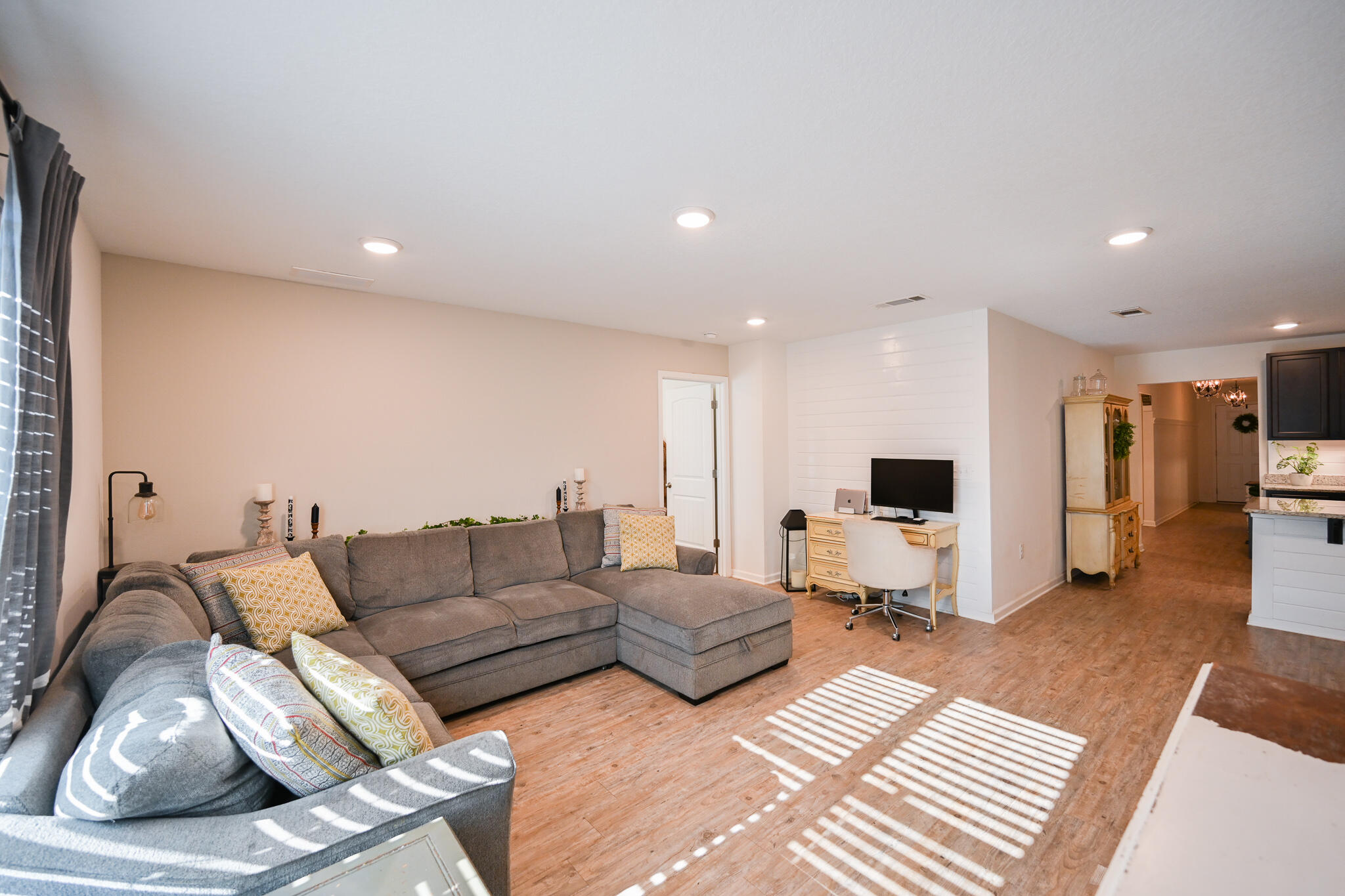 351 Merlin Court Crestview, FL 32539 - Photo 9 of 63 a living room with furniture and a flat screen tv