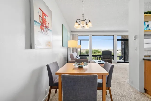 a kitchen with stainless steel appliances granite countertop a sink and dishwasher a stove with wooden floor