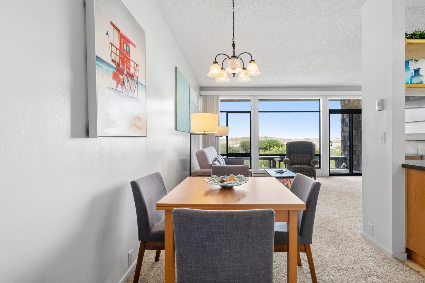 52 Pelican Point Watsonville, CA 95076 - Photo 12 of 36 a view of a dining room with furniture wooden floor and a chandelier
