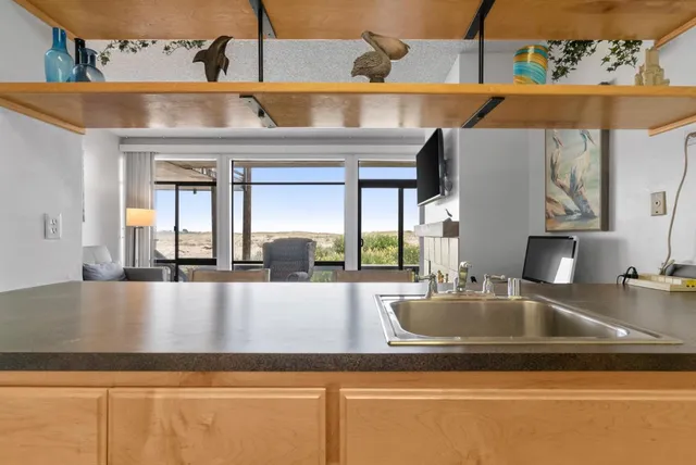 a kitchen that has a sink and a stove