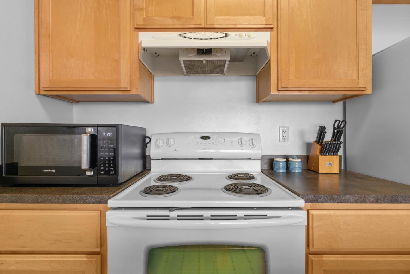 52 Pelican Point Watsonville, CA 95076 - Photo 16 of 36 a stove top oven sitting inside of a kitchen