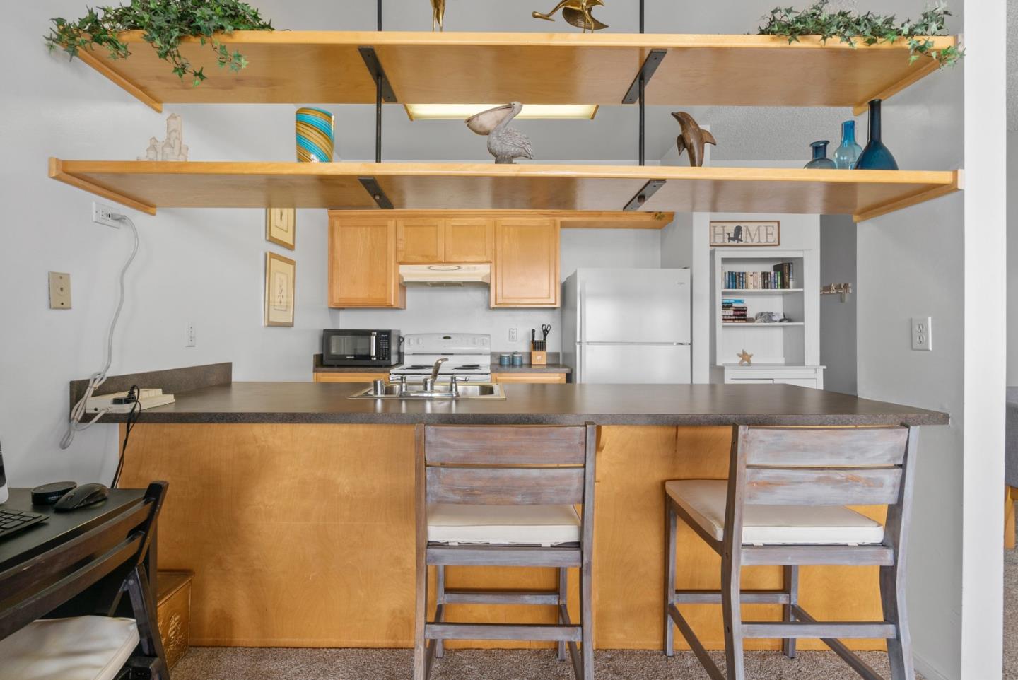 52 Pelican Point Watsonville, CA 95076 - Photo 17 of 36 a kitchen with a refrigerator and a sink