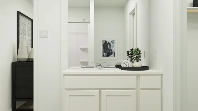 a white toilet sitting next to a white sink