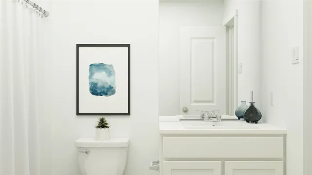 a bedroom with a bed and a night stand