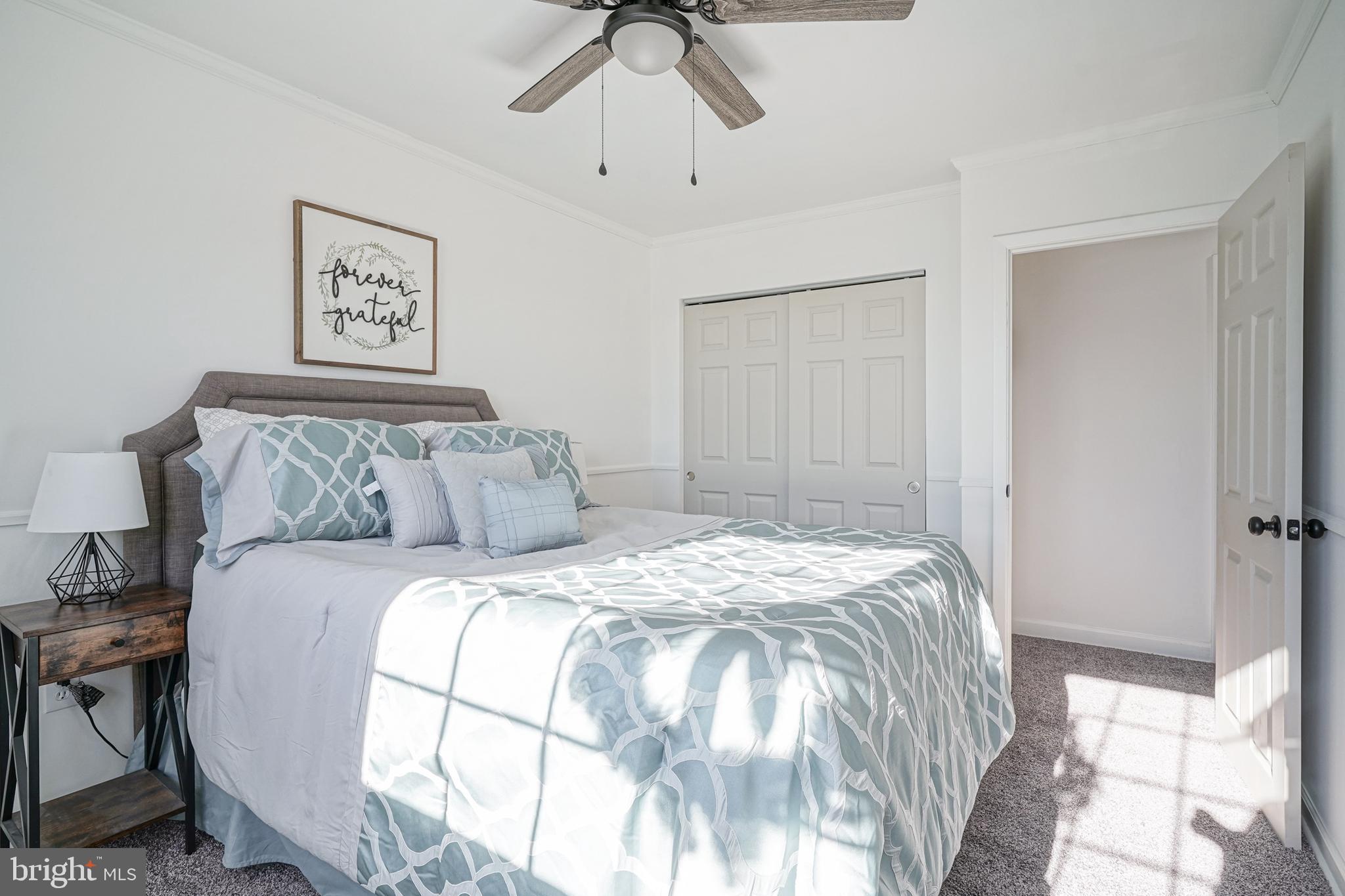 4 North Fork Road Clementon, NJ 08021 - Photo 25 of 37 a bedroom with a bed and a chandelier