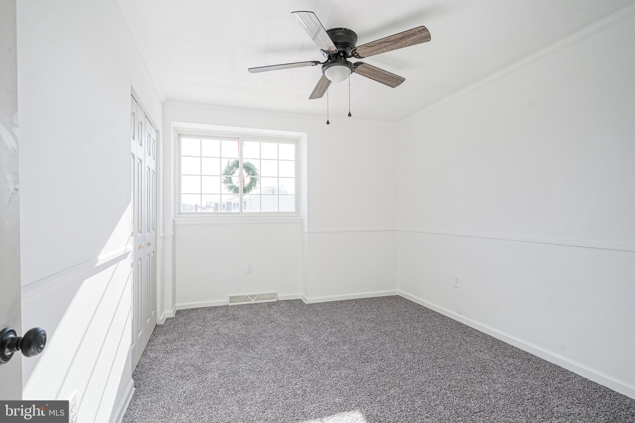 4 North Fork Road Clementon, NJ 08021 - Photo 29 of 37 an empty room with a window and a fan