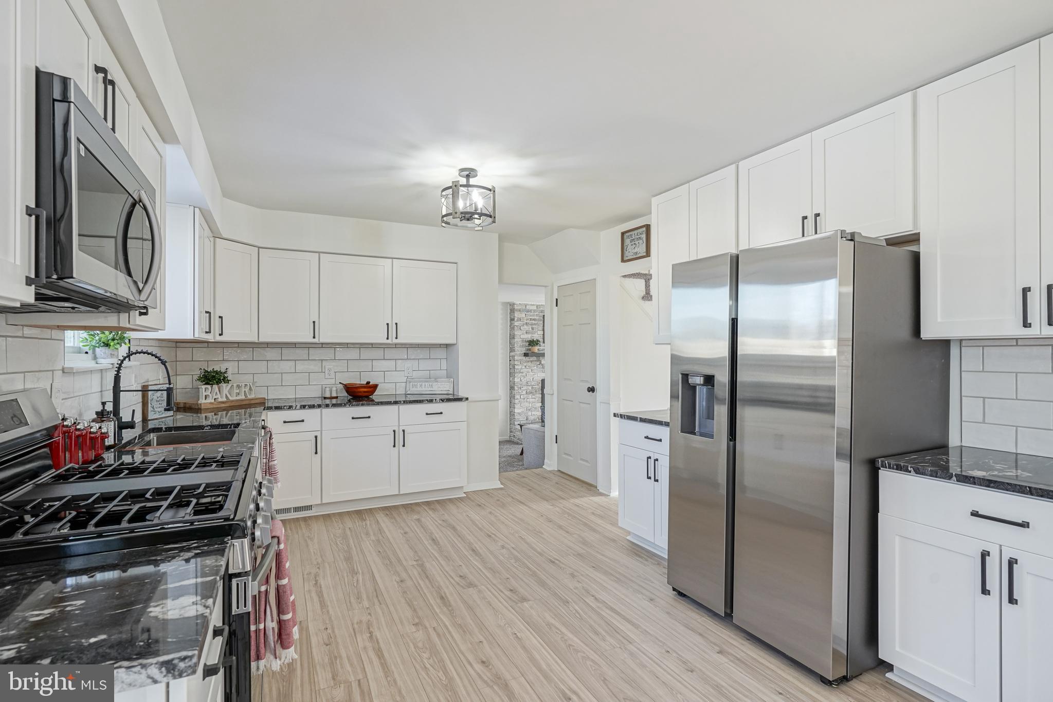 4 North Fork Road Clementon, NJ 08021 - Photo 10 of 37 a kitchen with stainless steel appliances a refrigerator sink and cabinets