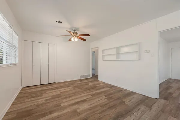 a view of an empty room with a window