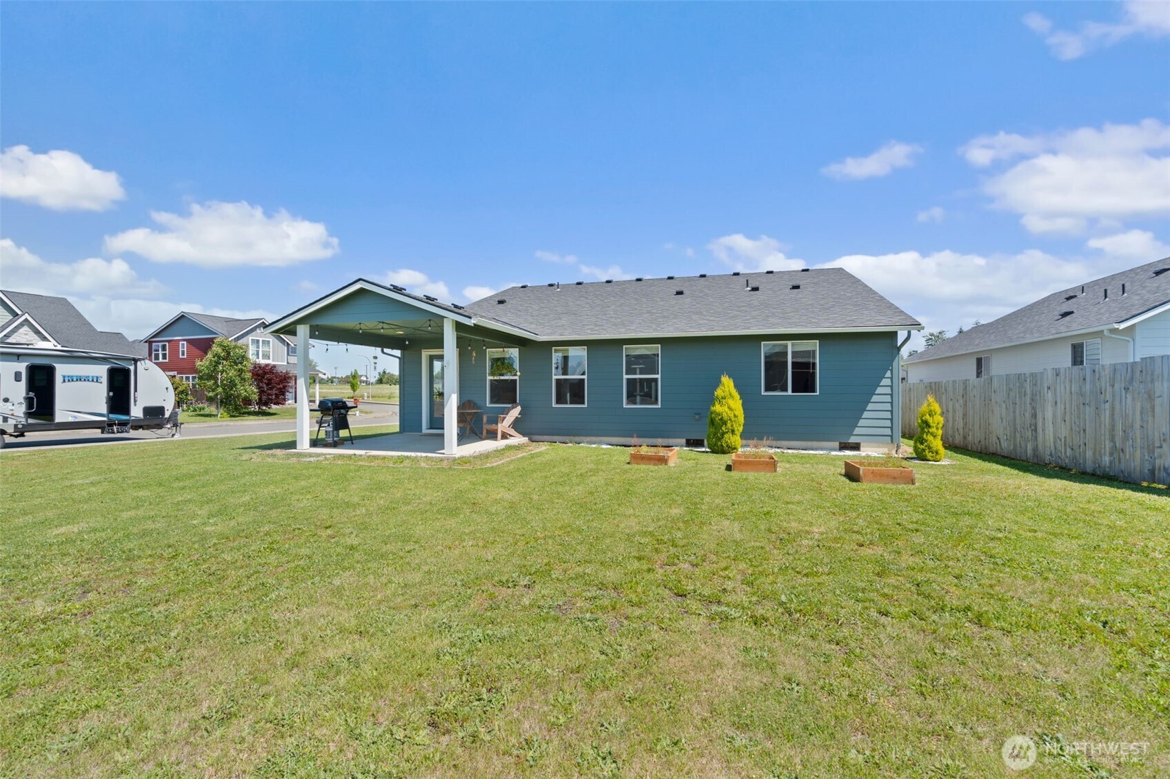 401 Cardinal Avenue Winlock, WA 98596 - Photo 23 of 39 a front view of a house with a yard and trees