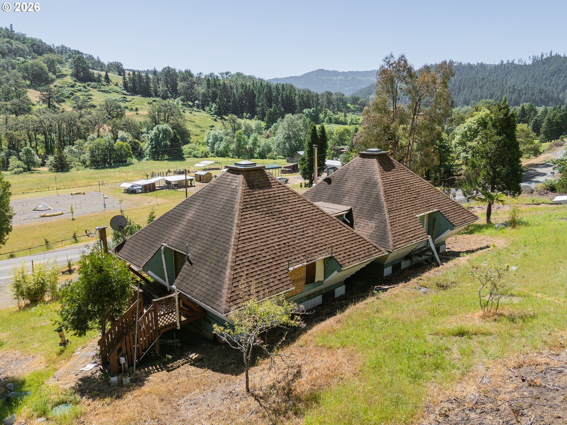 3707 Willis Creek Road Winston, OR 97496 - Photo 3 of 30 a view of a house with pool and a yard