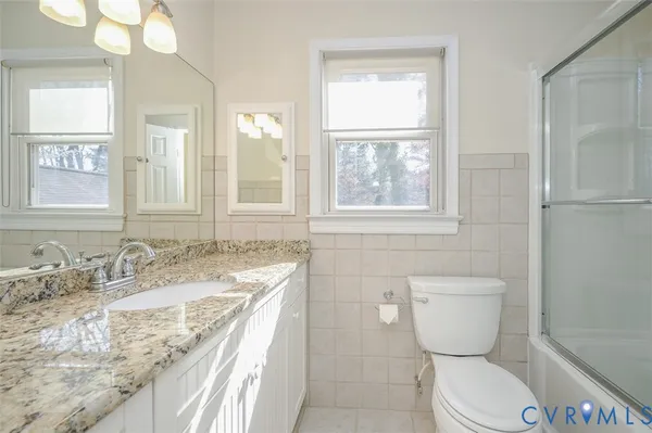 a view of a porch with wooden floor and a table
