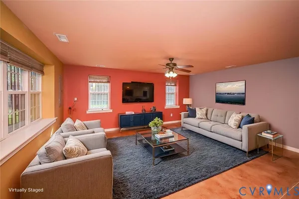 a view of a house with a yard and sitting area