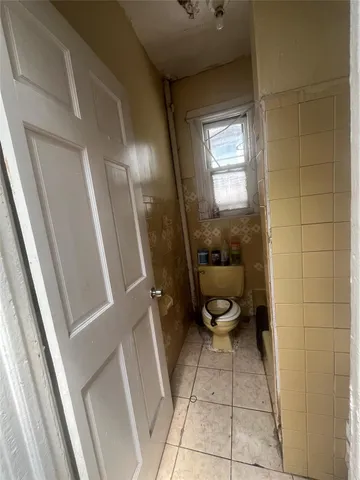 a bathroom with a toilet and a sink