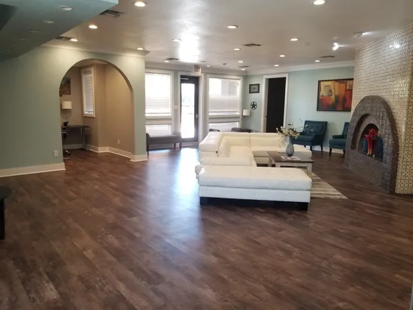 a living room with furniture and a large window