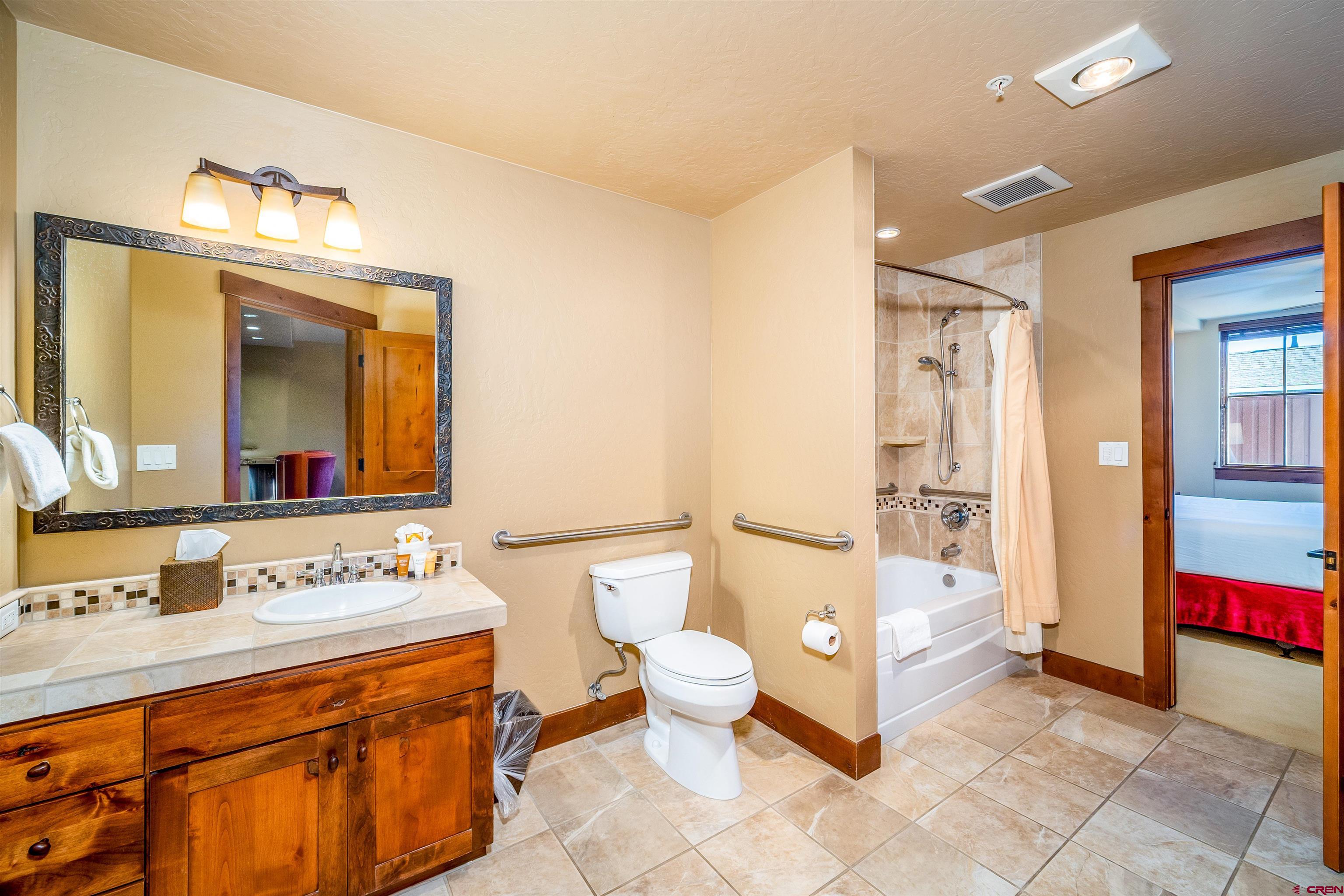 24 Sheol Street, Unit 205 Durango, CO 81301 - Photo 18 of 39 a spacious bathroom with a sink and a mirror