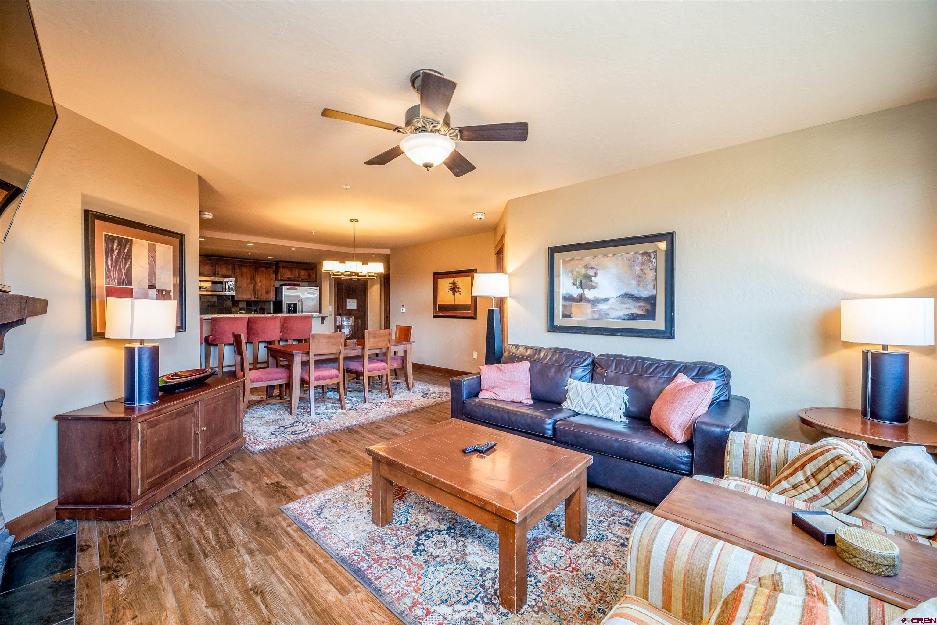 24 Sheol Street, Unit 205 Durango, CO 81301 - Photo 4 of 39 a living room with furniture and a flat screen tv