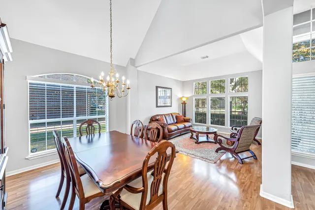 a view of a dining room with furniture window and outside view